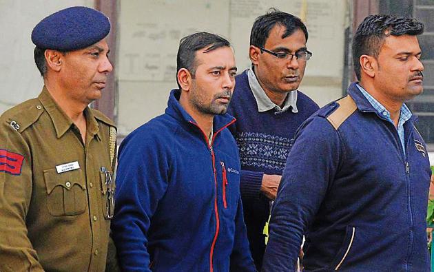 Harmehtab Singh Rarewala (second from left) in police custody at district courts.(Keshav Singh/HT) Harmehtab Singh Rarewala (second from left) in police custody at district courts.(Keshav Singh/HT)