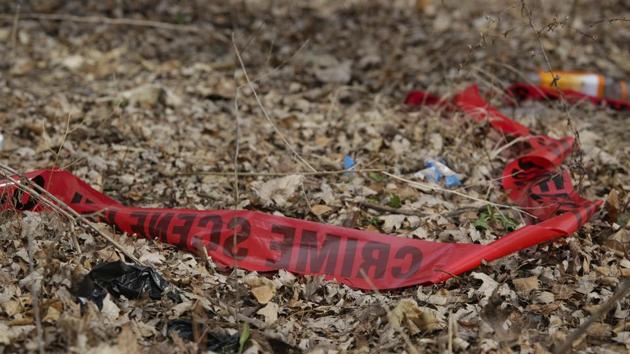 Police tape litters the ground at the scene of a February 14 shooting that killed a toddler and a man. Chicago police are examining dramatic video that captured the killing and was streamed live on Facebook. It was taken from inside a car driven by a young woman who was wounded in the shooting.(AP) Police tape litters the ground at the scene of a February 14 shooting that killed a toddler and a man. Chicago police are examining dramatic video that captured the killing and was streamed live on Facebook. It was taken from inside a car driven by a young woman who was wounded in the shooting.(AP)