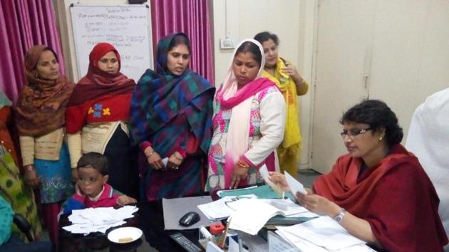 A group of aggrieved women gave a written complaint to additional district magistrate Priti Jaiswal. (Peeyush Khandelwal/HT Photo) A group of aggrieved women gave a written complaint to additional district magistrate Priti Jaiswal. (Peeyush Khandelwal/HT Photo)
