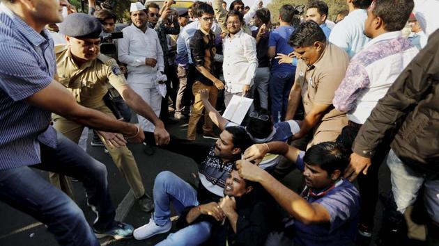 Police detain Congress workers during a protest in Ahmedabad after BJP workers were named in the gang rape in Naliya. (PTI File) Police detain Congress workers during a protest in Ahmedabad after BJP workers were named in the gang rape in Naliya. (PTI File)