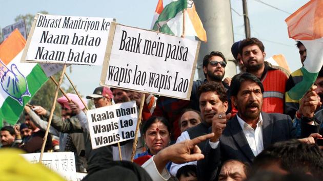 Party workers of the J&K Pradesh Congress Committee protest against Prime Minister Narendra Modi’s demonetisation move in November 2016. PM Modi said the note ban move was aimed at cracking down on black money. In this year’s budget, finance minister Arun Jaitley also announced guidelines for political funding, meant to streamline cash flow in parties, considered a blind spot in the fight against black money. (Nitin Kanotra / HT File Photo) Party workers of the J&K Pradesh Congress Committee protest against Prime Minister Narendra Modi’s demonetisation move in November 2016. PM Modi said the note ban move was aimed at cracking down on black money. In this year’s budget, finance minister Arun Jaitley also announced guidelines for political funding, meant to streamline cash flow in parties, considered a blind spot in the fight against black money. (Nitin Kanotra / HT File Photo)