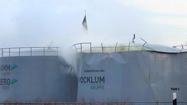 Sulfuric acid leaks out of a tank in Oberhausen, Germany on Thursday.(AP Photo)