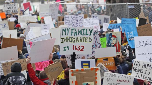 Protesters carry signs and chant in Lafayette Park near the White House in Washington during a demonstration to denounce President Donald Trump's executive order that barred citizens of seven Muslim-majority countries from entering the US.(AP File Photo)