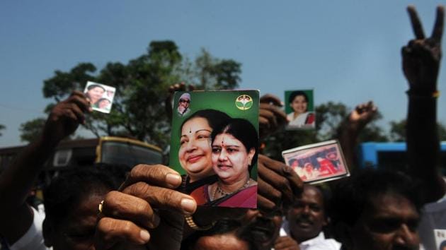 AIADMK members celebrate outside governor Vidyasagar Rao’s residence on Thursday after Edappadi Palaniswami was invited to form the government.(AFP photo)