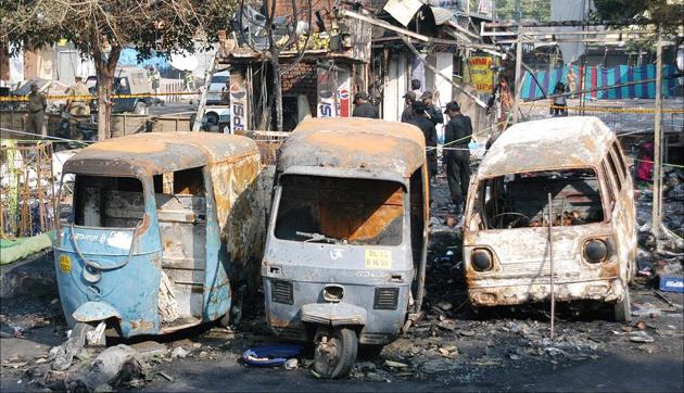 Burnt vehicles at the site of blast in Sarojini Nagar in 2005. Maximum casualties occurred in Sarojini Nagar.(S Burmaula/HT Photo)