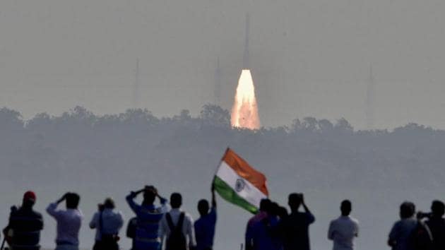 People watch as a rocket from space agency Indian Space Research Organisation (ISRO) takes off successfully to launch a record 104 satellites, including India’s earth observation satellite on-board PSLV-C37 from the spaceport of Sriharikota on Wednesday, Feb 15, 2017.(PTI)