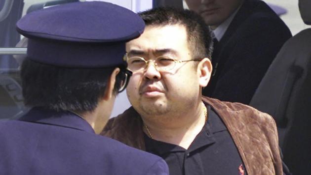 Kim Jong Nam, exiled half brother of North Korea's leader Kim Jong Un, being escorted by Japanese police officers at the airport in Narita, Japan, in May 2001. Kim Jong Nam told medical workers before he died on February 13, 2017, that he had been attacked at a Malaysian airport with a chemical spray, according to Malaysian officials. (AP File) Kim Jong Nam, exiled half brother of North Korea's leader Kim Jong Un, being escorted by Japanese police officers at the airport in Narita, Japan, in May 2001. Kim Jong Nam told medical workers before he died on February 13, 2017, that he had been attacked at a Malaysian airport with a chemical spray, according to Malaysian officials. (AP File)