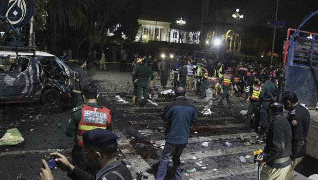 Police and security officers cordon off the area of a deadly bombing, in Lahore, Pakistan on Feb 13, 2017 (AP Photo) Police and security officers cordon off the area of a deadly bombing, in Lahore, Pakistan on Feb 13, 2017 (AP Photo)