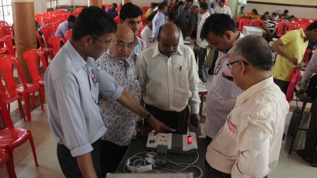 An officer demonstrates the use of an electronic voting machine (EVM) during a training camp at NM Joshi School in Lower Parel recently. (Bhushan Koyande) An officer demonstrates the use of an electronic voting machine (EVM) during a training camp at NM Joshi School in Lower Parel recently. (Bhushan Koyande)