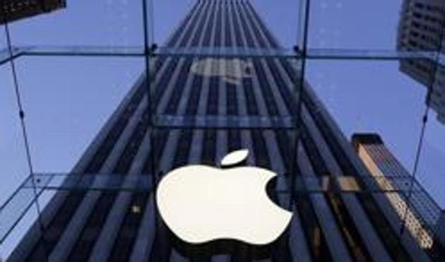 The Apple logo hangs in the glass box entrance to the company's Fifth Avenue store in New York. (AP)