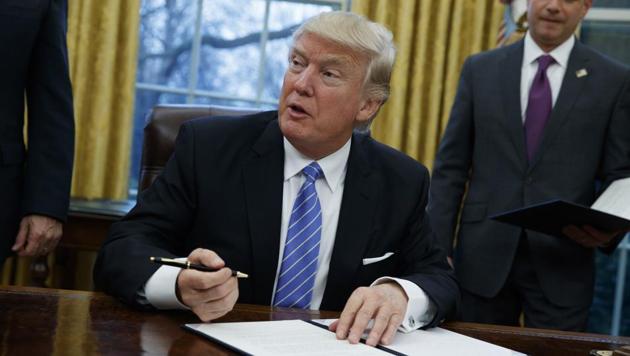 President Donald Trump signs an executive order to withdraw the US from the Trans-Pacific Partnership trade pact agreed to under the Obama administration, in the Oval Office of the White House in Washington. (AP File Photo) President Donald Trump signs an executive order to withdraw the US from the Trans-Pacific Partnership trade pact agreed to under the Obama administration, in the Oval Office of the White House in Washington. (AP File Photo)