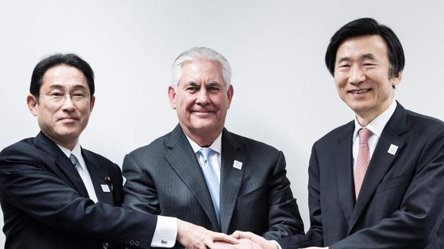 Japan's foreign minister Fumio Kishida (L), US secretary of state Rex Tillerson (C) and South Korean foreign minister Yun Byung-Se (R) shake hands before a meeting at the World Conference Center February 16, 2017 in Bonn, Germany.(AFP)
