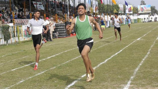 Athletes participating in a race on the inaugural day of Kila Raipur Rural Sports Festival at village Kila Raipur in Ludhiana on Friday. (Gurminder Singh/HT Photo)