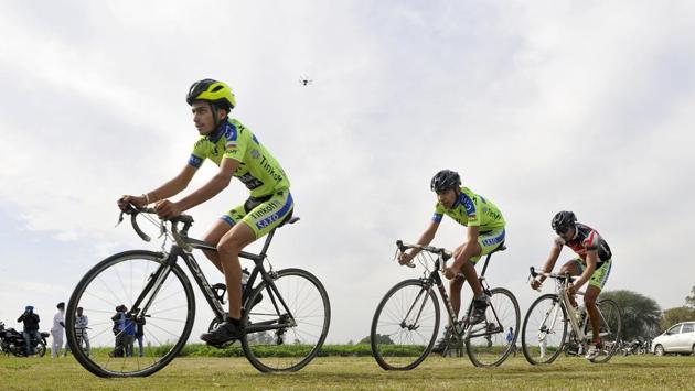 Cycle race in progress on the inaugural day of Kila Raipur Rural Sports Festival at village Kila Raipur in Ludhiana on Friday. (Gurminder Singh/HT Photo)