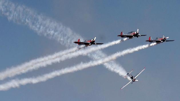 Pilots of Britain's aerobatic team, Yakovlevs perform aerial stunts during a display on the third day of the 11th edition of Aero India 2017 at Yelahanka Air Force Station in Bengaluru on February 16, 2017.(AFP)