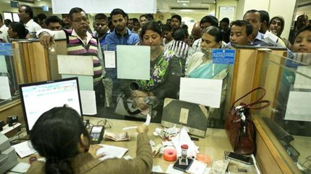 File photo of people depositing discontinued notes on the last day of a window set by the government.(AP File Photo)