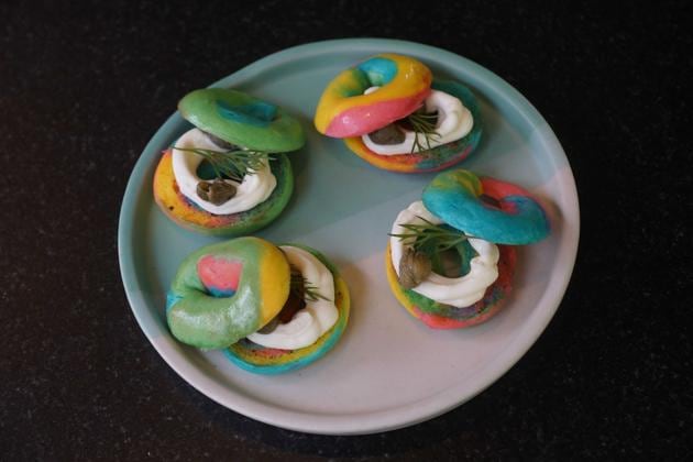 A plate of bite-sized, Instagram-friendly rainbow bagel amuse-bouches are presented immediately after we place our order. Chewy and firm with a filling of cream cheese and olives, they’re an amusing start to the meal.(Prodip Guha/HT Photo)