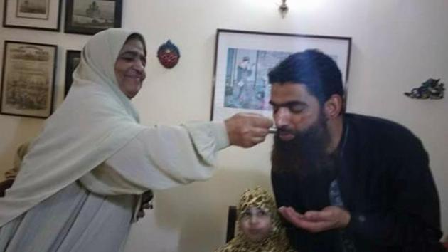 In this photograph circulated on Facebook, Rafiq Shah is seen being fed by his mother after his release.(Photo credit: Rights activist Khurram Parvez’s FB wall)