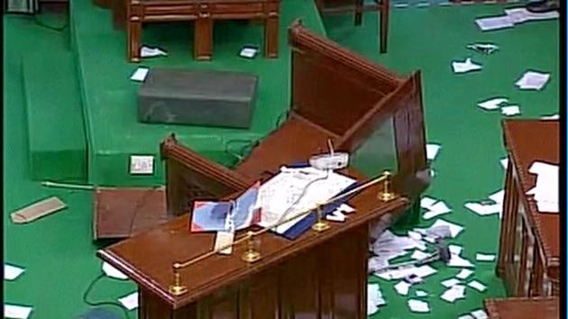Broken tables and torn papers inside the Tamil Nadu assembly on Saturday.(ANI/Twitter)