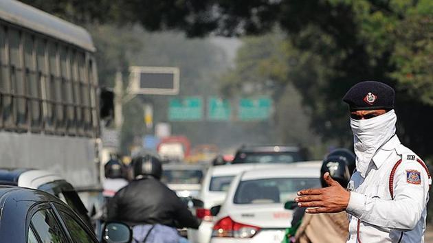 A traffic policeman at Mathura road near New Friends Colony. Traffic congestion is the most visible issue, with pollution levels almost always in the red. (Burhaan Kinu/ HT photo) A traffic policeman at Mathura road near New Friends Colony. Traffic congestion is the most visible issue, with pollution levels almost always in the red. (Burhaan Kinu/ HT photo)