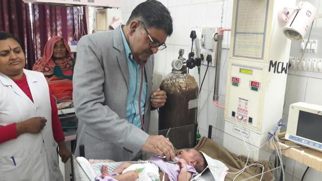 A doctor examining a newborn in a government hospital in Rajasthan. (HT Photo) A doctor examining a newborn in a government hospital in Rajasthan. (HT Photo)