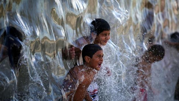 Children play with water in Madureira Park in Rio de Janeiro, Brazil on February 12, 2017. (Pilar Olivares / REUTERS)