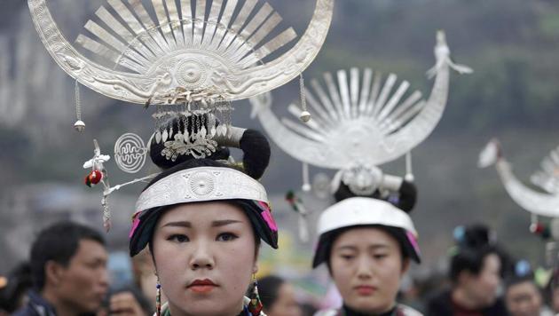 Members of the Miao ethnic minority group dance at a circle in a public square in Zhouxi township in Kaili in southwestern China's Guizhou province on Feb. 16, 2017. (AP Photo)