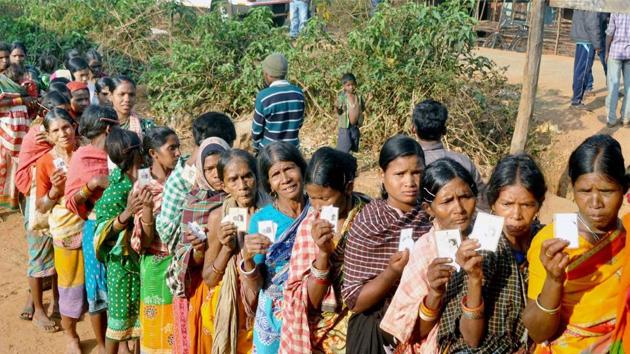 Voters wait in queue to exercise their franchise in the first phase of the Odisha Panchayat Polls in Kandhamal(PTI Photo)