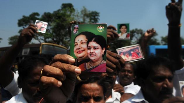 Members of the AIADMK party display portraits of VK Sasikala and former Tamil Nadu CM J Jayalalithaa, in Chennai on February 16.(AFP)