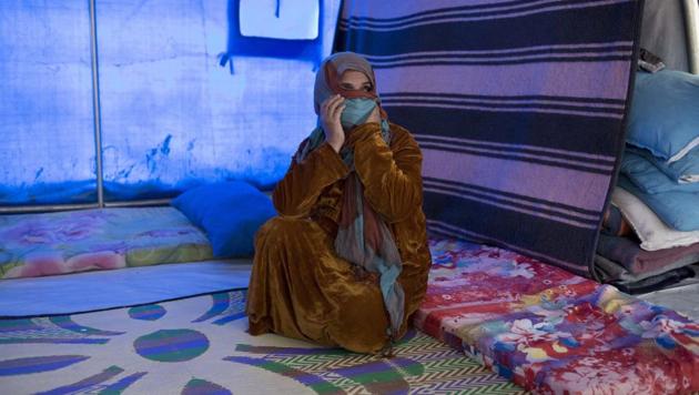 Umm Mohammed, a resident of western Mosul, sits inside her tent in a camp east of Mosul. She didn't want to leave her home but her husband told her the alternative was that they would starve to death, because of a lack of food. (AP) Umm Mohammed, a resident of western Mosul, sits inside her tent in a camp east of Mosul. She didn't want to leave her home but her husband told her the alternative was that they would starve to death, because of a lack of food. (AP)