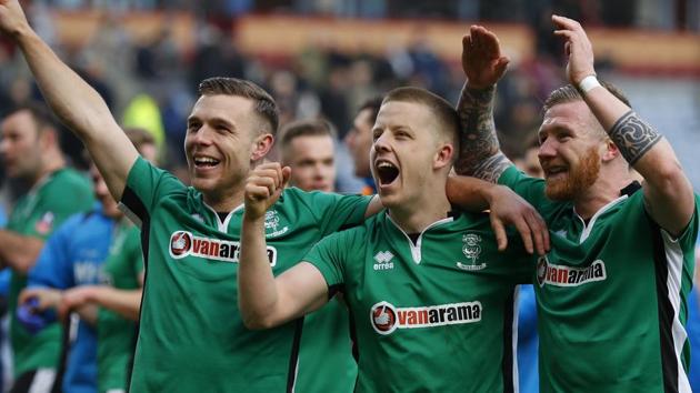 Lincoln City's Alan Power, Terry Hawkridge and Jonathan Jack Muldoon celebrate after the FA Cup match against Burnley. (REUTERS) Lincoln City's Alan Power, Terry Hawkridge and Jonathan Jack Muldoon celebrate after the FA Cup match against Burnley. (REUTERS)