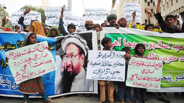 Pakistani Hindu demonstrators hold placards and banners during a protest after Jamaat-ud-Dawa (JuD) organisation leader Hafiz Saeed was placed under house arrest in Karachi on February 1, 2017. (AFP File Photo) Pakistani Hindu demonstrators hold placards and banners during a protest after Jamaat-ud-Dawa (JuD) organisation leader Hafiz Saeed was placed under house arrest in Karachi on February 1, 2017. (AFP File Photo)