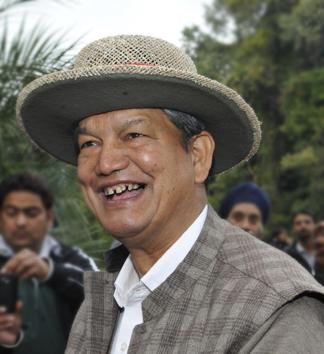 Chief minister Harish Rawat pose for camerapersons in Dehradun.(HT Photo) Chief minister Harish Rawat pose for camerapersons in Dehradun.(HT Photo)