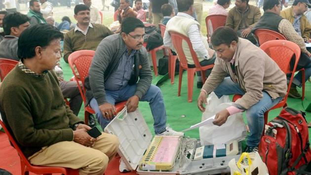 Election officials check EVMs on the eve of the third phase of the UP assembly polls in Lucknow on Saturday. (PTI Photo) Election officials check EVMs on the eve of the third phase of the UP assembly polls in Lucknow on Saturday. (PTI Photo)
