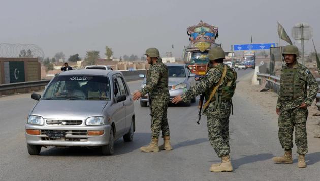 Pakistani paramilitary soldiers stop a vehicle at a security check point in Peshawar on February 17, following bomb attack on a shrine of 13th century Muslim Sufi saint Lal Shahbaz Qalandar in the town of Sehwan in Sindh province. (AFP Photo) Pakistani paramilitary soldiers stop a vehicle at a security check point in Peshawar on February 17, following bomb attack on a shrine of 13th century Muslim Sufi saint Lal Shahbaz Qalandar in the town of Sehwan in Sindh province. (AFP Photo)