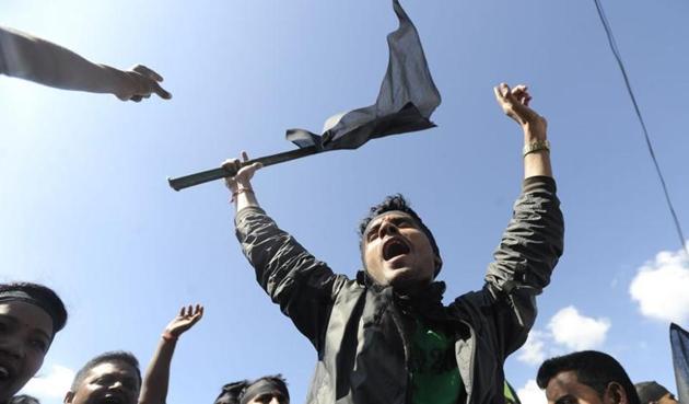 Nepalese activists from the Federal Alliance (members of the Madhesi and ethnic communities) chant anti-constitution slogans on the first anniversary of Nepal’s new constitution in Kathmandu on September 19. (AFP file) Nepalese activists from the Federal Alliance (members of the Madhesi and ethnic communities) chant anti-constitution slogans on the first anniversary of Nepal’s new constitution in Kathmandu on September 19. (AFP file)