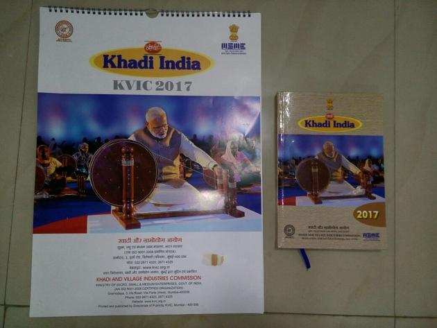 The PM’s photograph -- which was published on the cover pages of the KVIC 2017 calendar and diary -- shows Modi weaving on a large charkha, in the same classic pose as Mahatma Gandhi. (Twitter) The PM’s photograph -- which was published on the cover pages of the KVIC 2017 calendar and diary -- shows Modi weaving on a large charkha, in the same classic pose as Mahatma Gandhi. (Twitter)