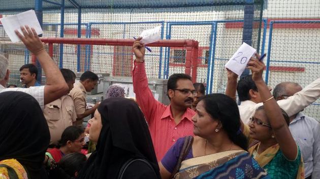 PAPER WORK COMES FIRST: Officials line up for poll-related work. (ANSHUMAN POYREKAR/HT)