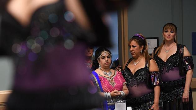 Dancers wait to perform in the Open category of the 2017 ‘Belly Dancer of the Universe Competition’ in Long Beach, California. (Mark RALSTON / AFP) Dancers wait to perform in the Open category of the 2017 ‘Belly Dancer of the Universe Competition’ in Long Beach, California. (Mark RALSTON / AFP)