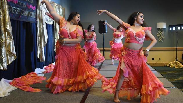 Dancers perform during the Group Final category of the 2017 ‘Belly Dancer of the Universe Competition’ in Long Beach. (Mark RALSTON / AFP) Dancers perform during the Group Final category of the 2017 ‘Belly Dancer of the Universe Competition’ in Long Beach. (Mark RALSTON / AFP)