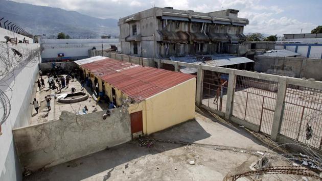 Prisoners in a courtyard at the National Penitentiary. Overcrowding, malnutrition and infectious diseases that flourish in jammed quarters have led to an upsurge of inmate deaths, including 21 at the Port-au-Prince penitentiary just last month. (Dieu Nalio Chery/AP)