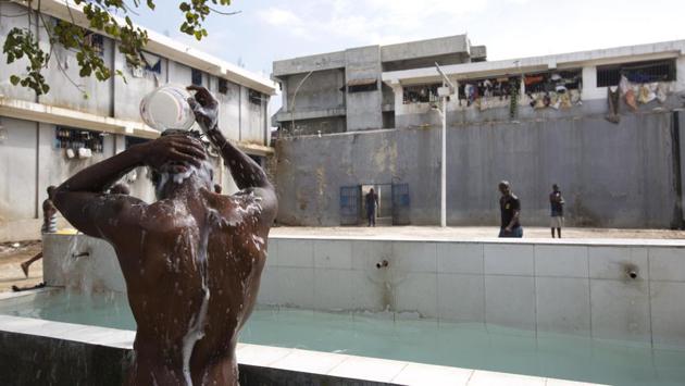 A prisoner bathes during recreation time. In 2008, the Inter-American Court of Human Rights ordered Haiti to bring its “inhuman” prisons in line with minimum international standards. (Dieu Nalio Chery/AP)