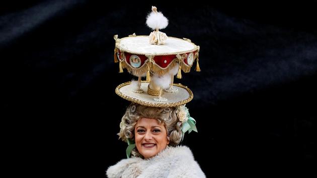 The event includes a beauty pageant winner, dressed in carnival costume, descending from the bell tower of St. Mark’s Basilica. (Alessandro Bianchi / REUTERS)