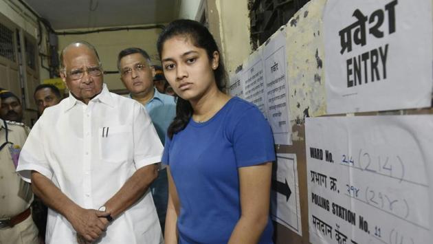 NCP chief Sharad Pawar with his granddaughter Revati at a polling booth in Mahalaxmi. (ANSHUMAN POYREKAR/HT PHOTO)