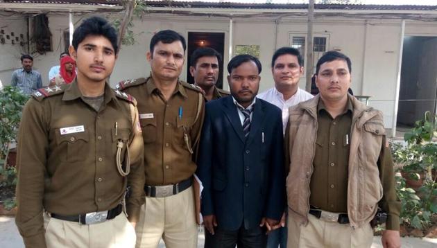 The impersonator, Sanjay Kumar Aarya, in police custody. (Handout) The impersonator, Sanjay Kumar Aarya, in police custody. (Handout)