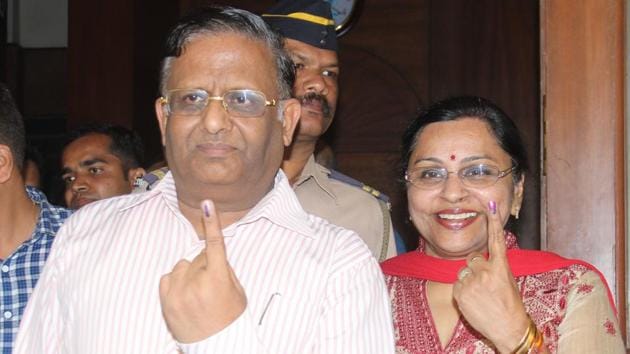 State election commissioner JS Saharia with his wife at a booth at KC College.  (bhushan koyande) 