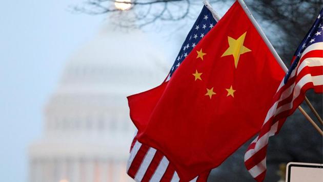 The People's Republic of China flag and the US Stars and Stripes fly along Pennsylvania Avenue near the US Capitol in Washington.(Reuters File Photo)