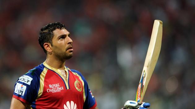 Royal Challengers Bangalore player Yuvraj Singh walks back to pavilion after his dismissal during an IPL T20 at Chinnaswamy stadium in Bengaluru in 2014. (Amounts from this year started to be paid in Indian Rupees due to currency fluctuations) He was auctioned for Rs. 14 Crore. (Hindustan Times)