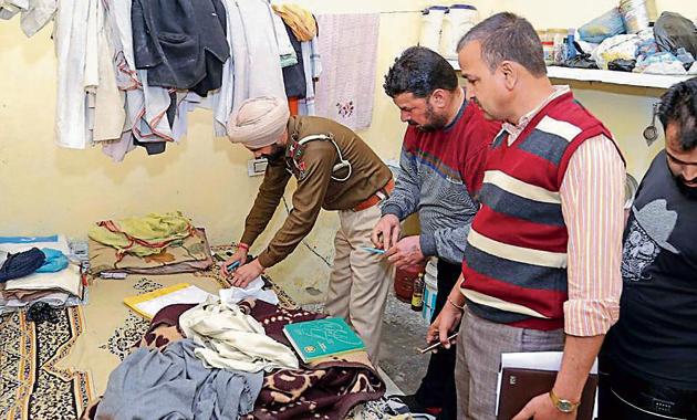 Police conducting their investigation at the Sanatan Dharam Mandir in Bharat Colony on Bhamiyan road after the priest was found murdered on Tuesday morning.(HT Photo)