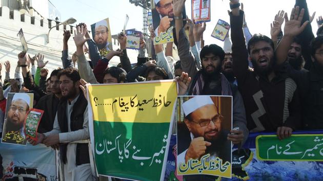 Pakistani supporters of the Jamaat-ud-Dawa (JuD) organisation shout slogans during a protest after JuD leader Hafiz Saeed was placed under house arrest by authorities in Lahore on February 10.(AFP) Pakistani supporters of the Jamaat-ud-Dawa (JuD) organisation shout slogans during a protest after JuD leader Hafiz Saeed was placed under house arrest by authorities in Lahore on February 10.(AFP)